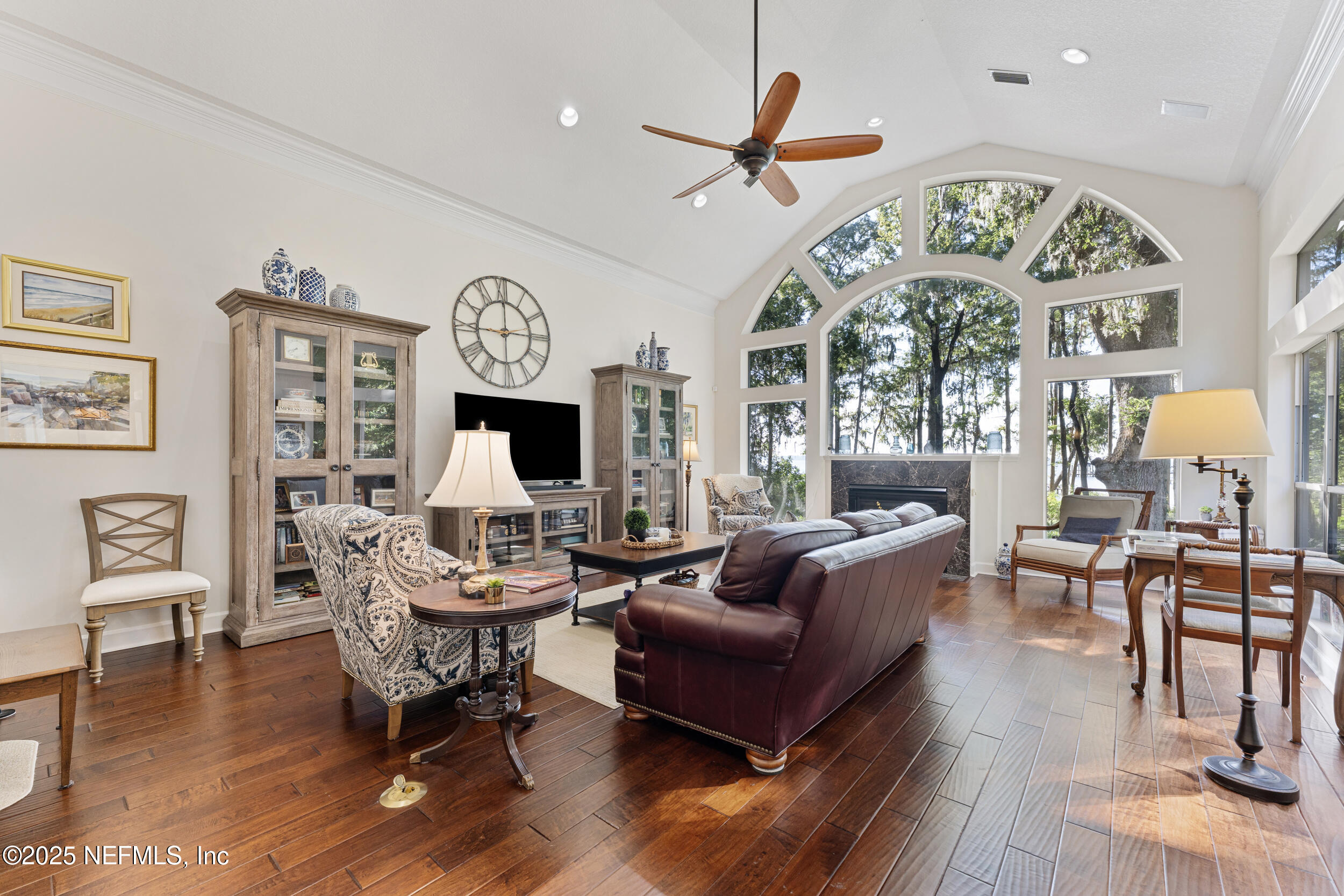 686 Frederic Drive Fleming Island, FL 32003 - Photo 19 of 57 a living room with fireplace furniture and a large window