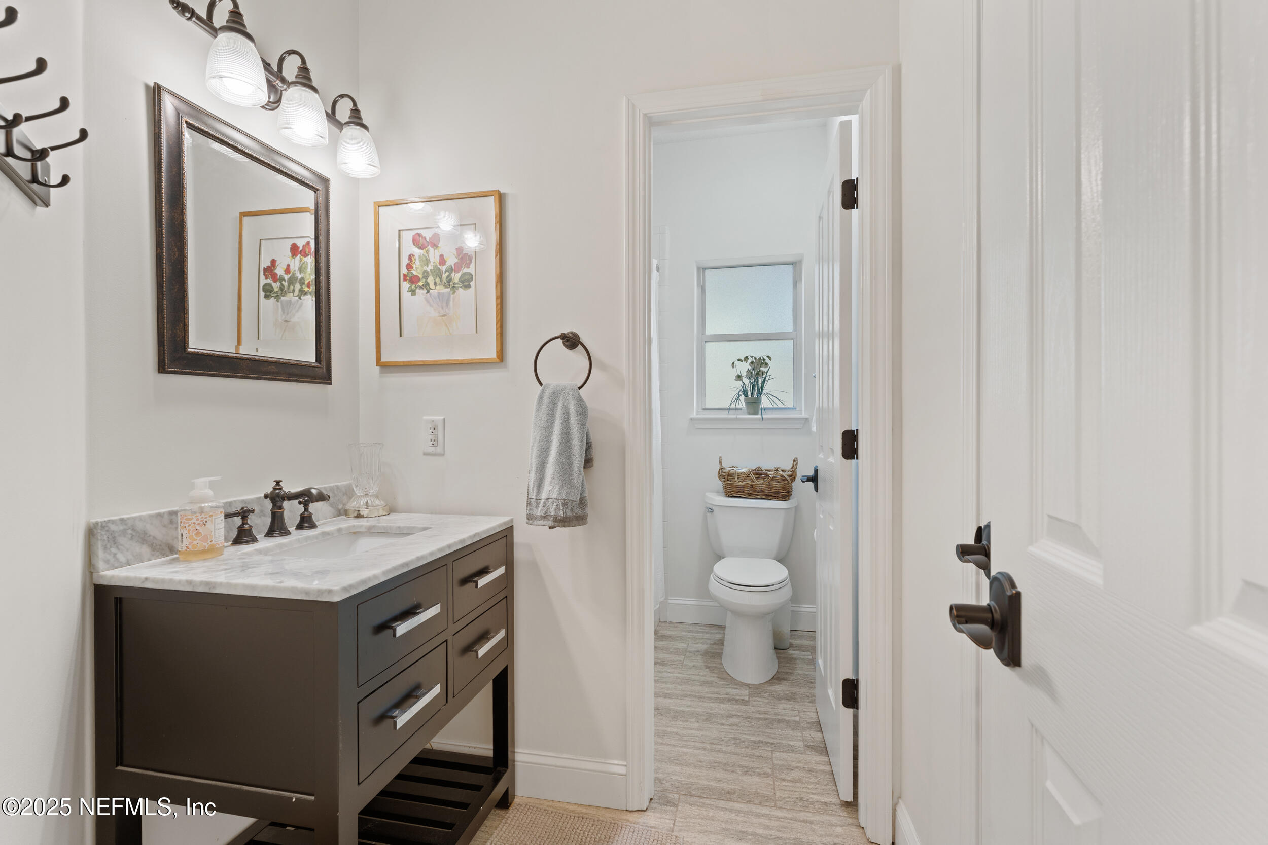 686 Frederic Drive Fleming Island, FL 32003 - Photo 31 of 57 a bathroom with a sink toilet and shower