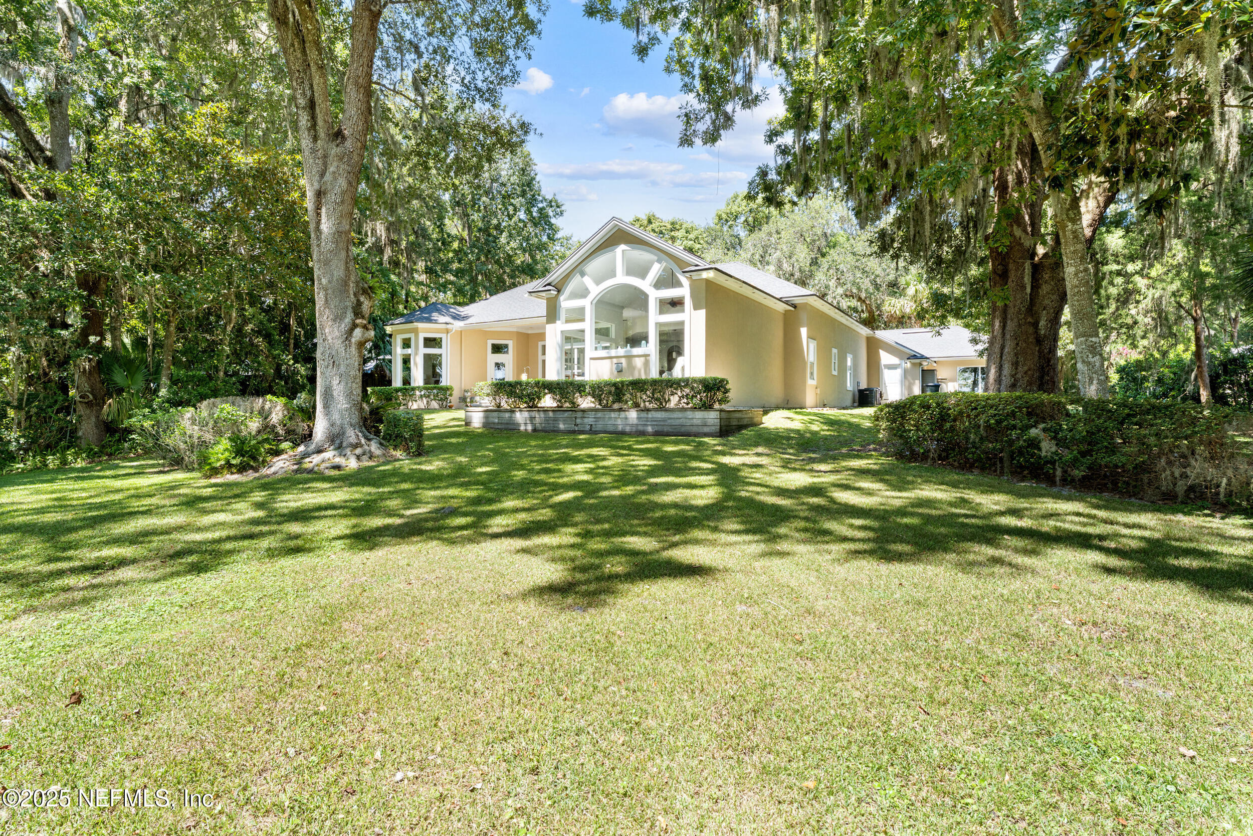 686 Frederic Drive Fleming Island, FL 32003 - Photo 42 of 57 a view of a house with a yard
