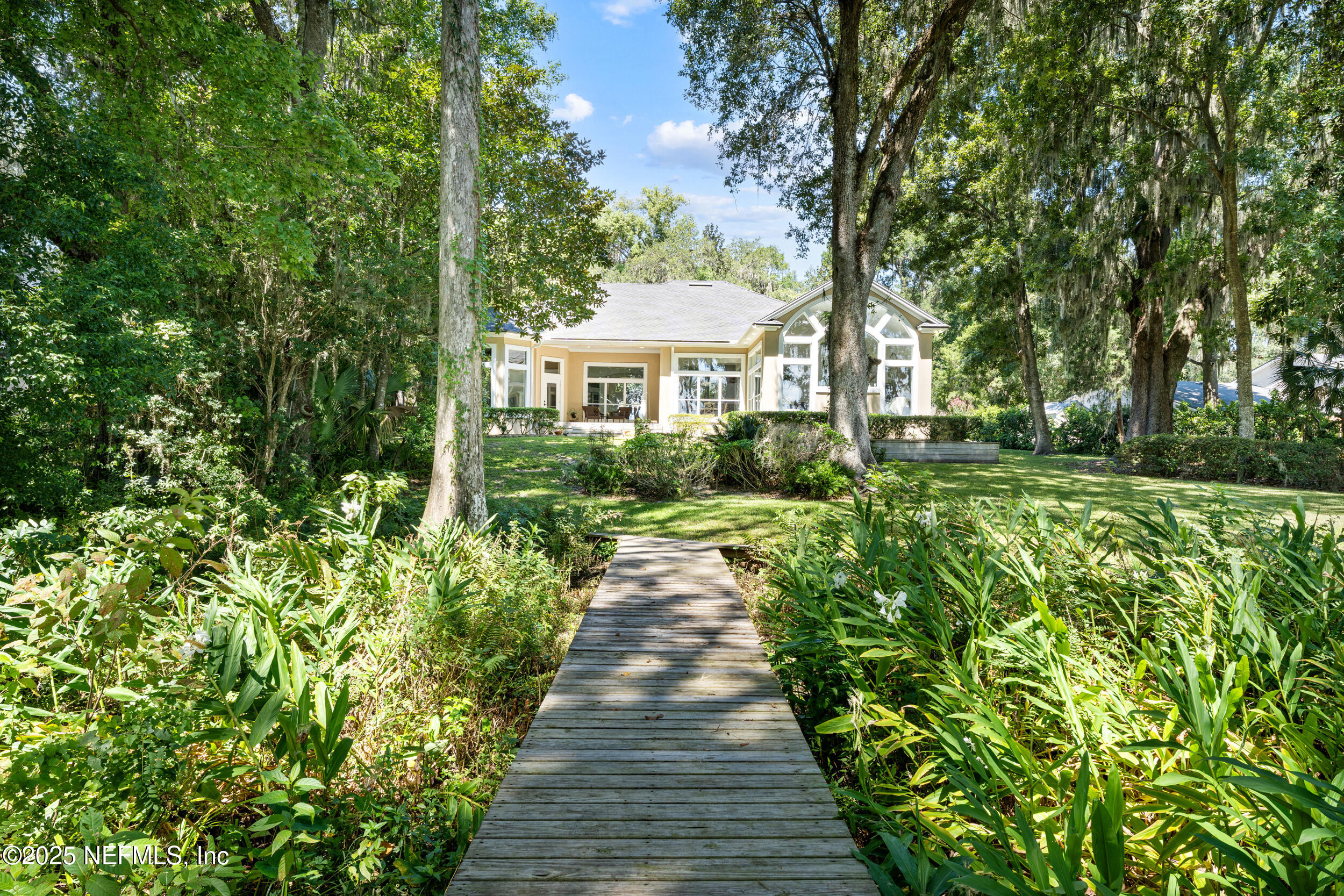 686 Frederic Drive Fleming Island, FL 32003 - Photo 43 of 57 a view of a house with a garden