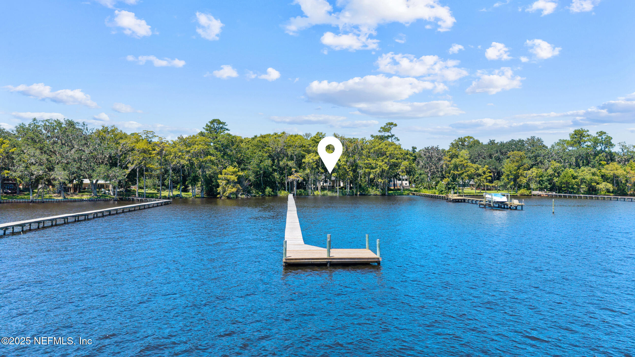 686 Frederic Drive Fleming Island, FL 32003 - Photo 45 of 57 a view of a lake with a yard