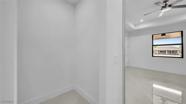 a view of a hallway with a window