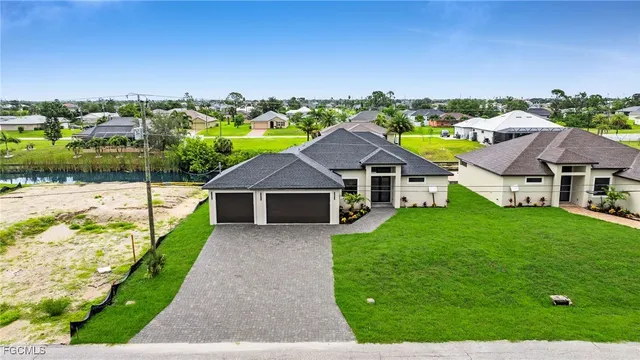 aerial view of a house with a yard