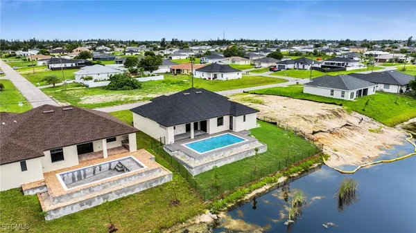 aerial view of a house with garden space and street view