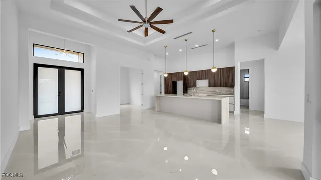 a view of a kitchen with a sink and a refrigerator