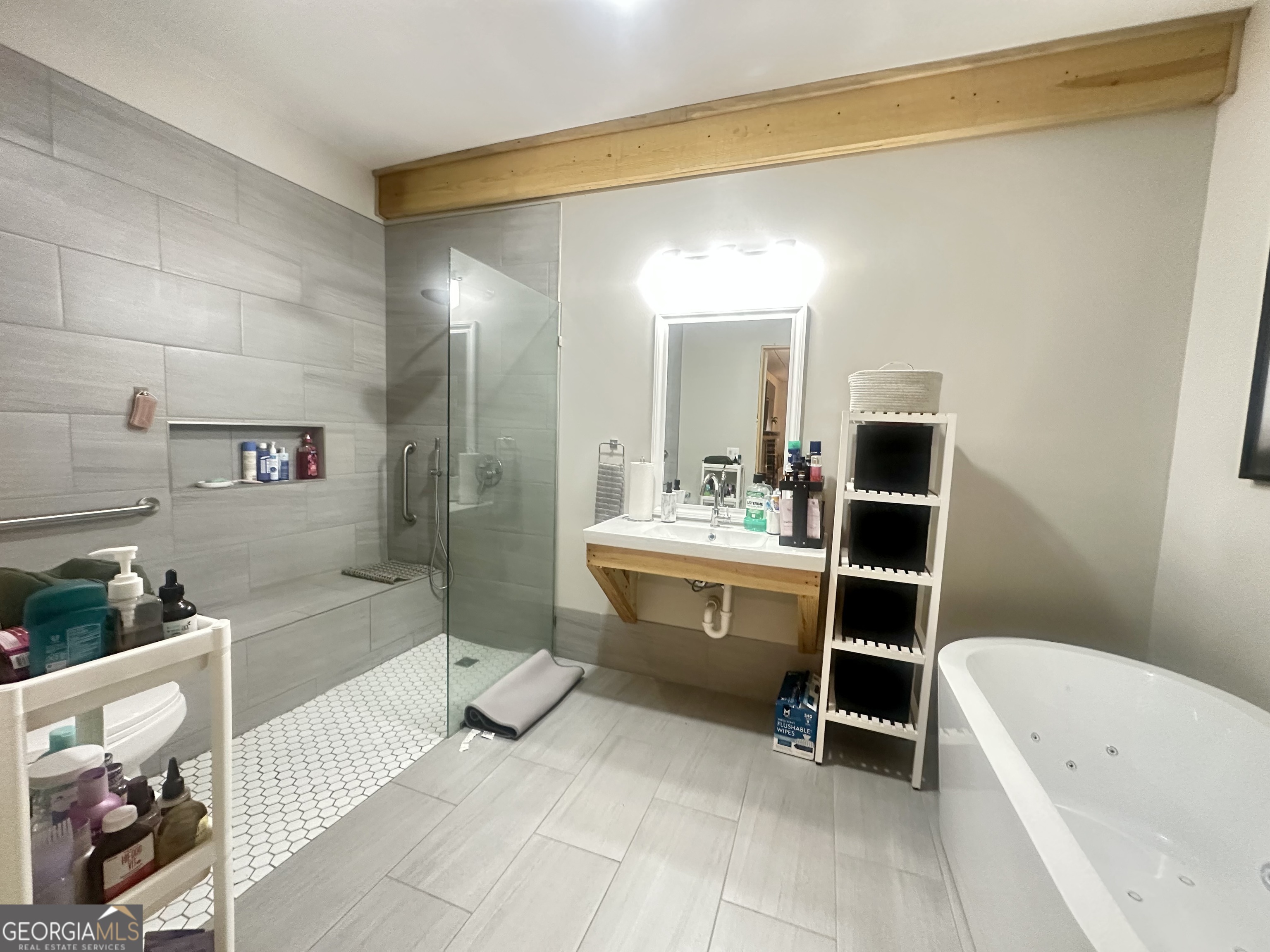 251 Bill Hambrick Road Eastman, GA 31023 - Photo 16 of 32 a bathroom with a tub a sink a mirror and a shower