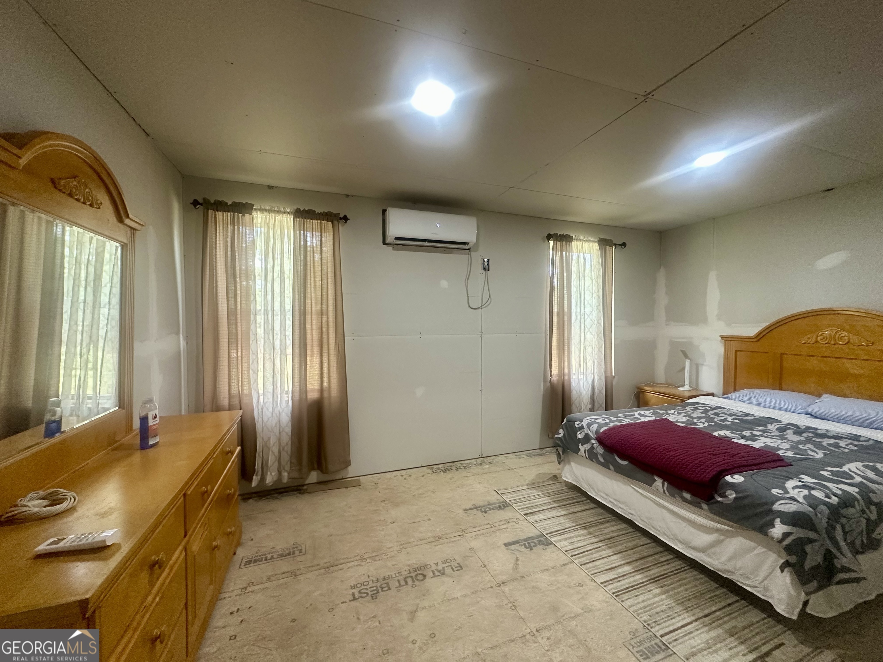 251 Bill Hambrick Road Eastman, GA 31023 - Photo 26 of 32 a bedroom with a bed and a window