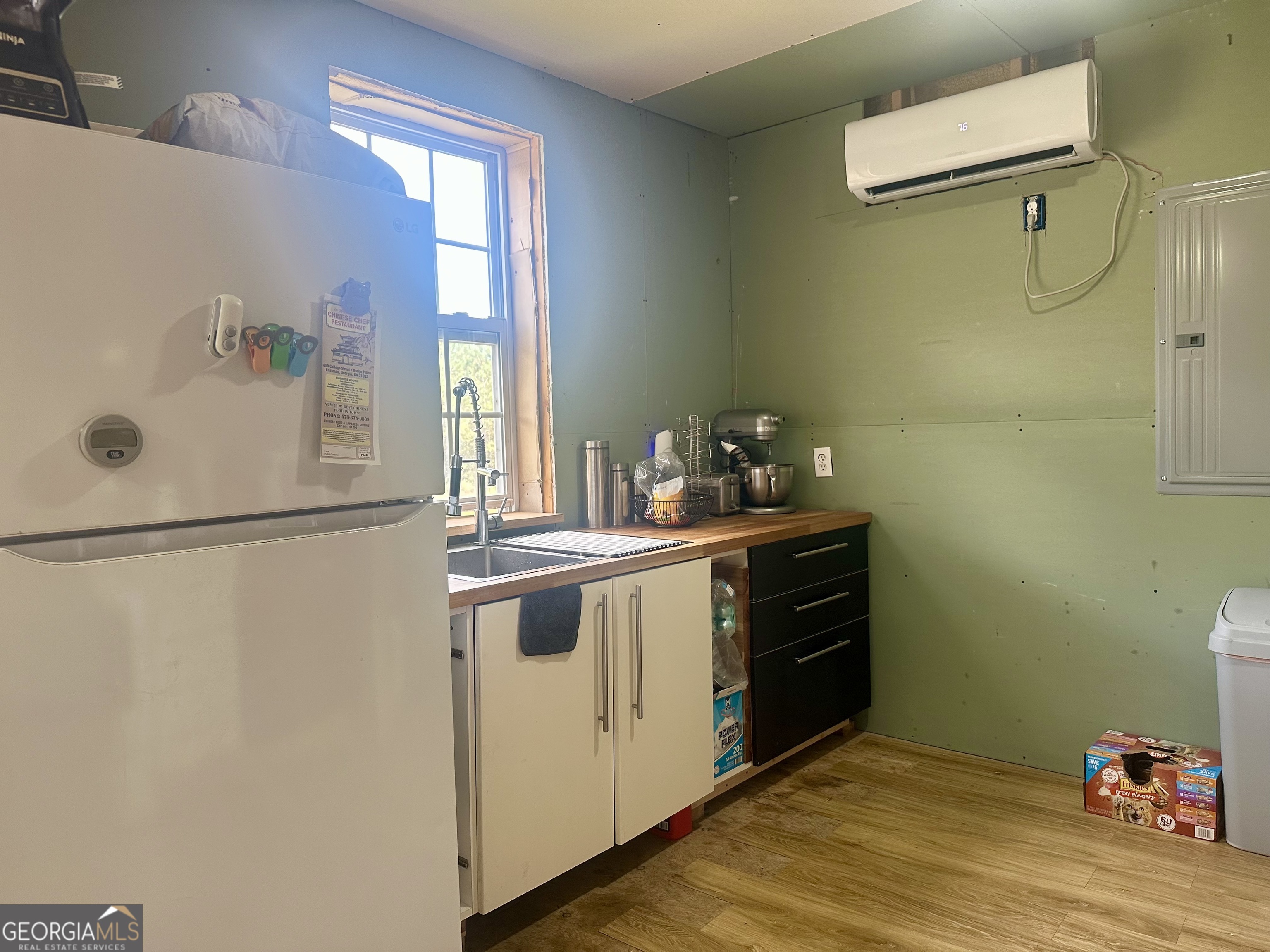 251 Bill Hambrick Road Eastman, GA 31023 - Photo 28 of 32 a kitchen with a refrigerator and a stove