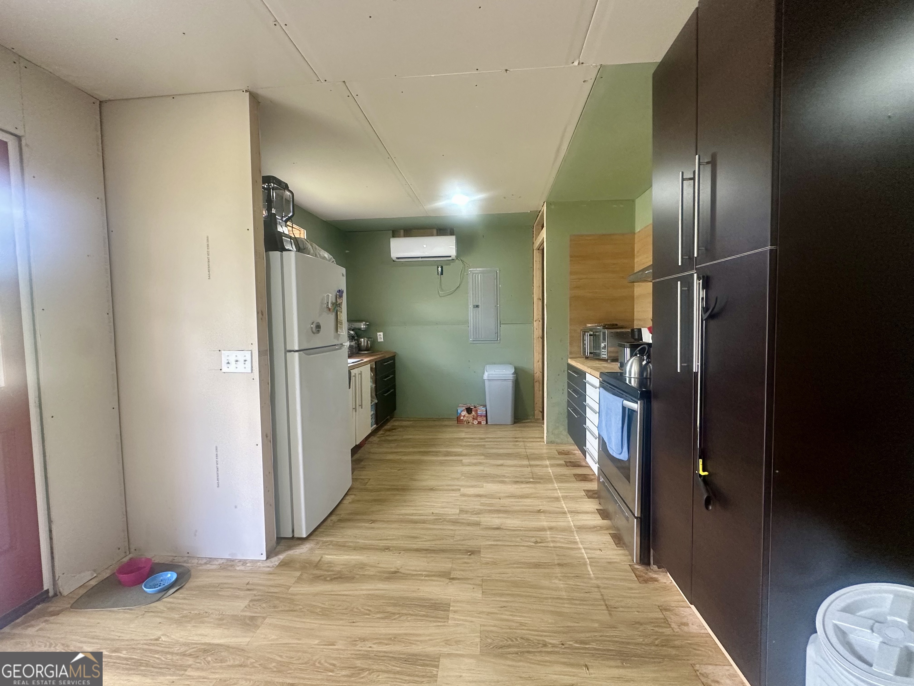 251 Bill Hambrick Road Eastman, GA 31023 - Photo 30 of 32 a view of a hallway with wooden floor