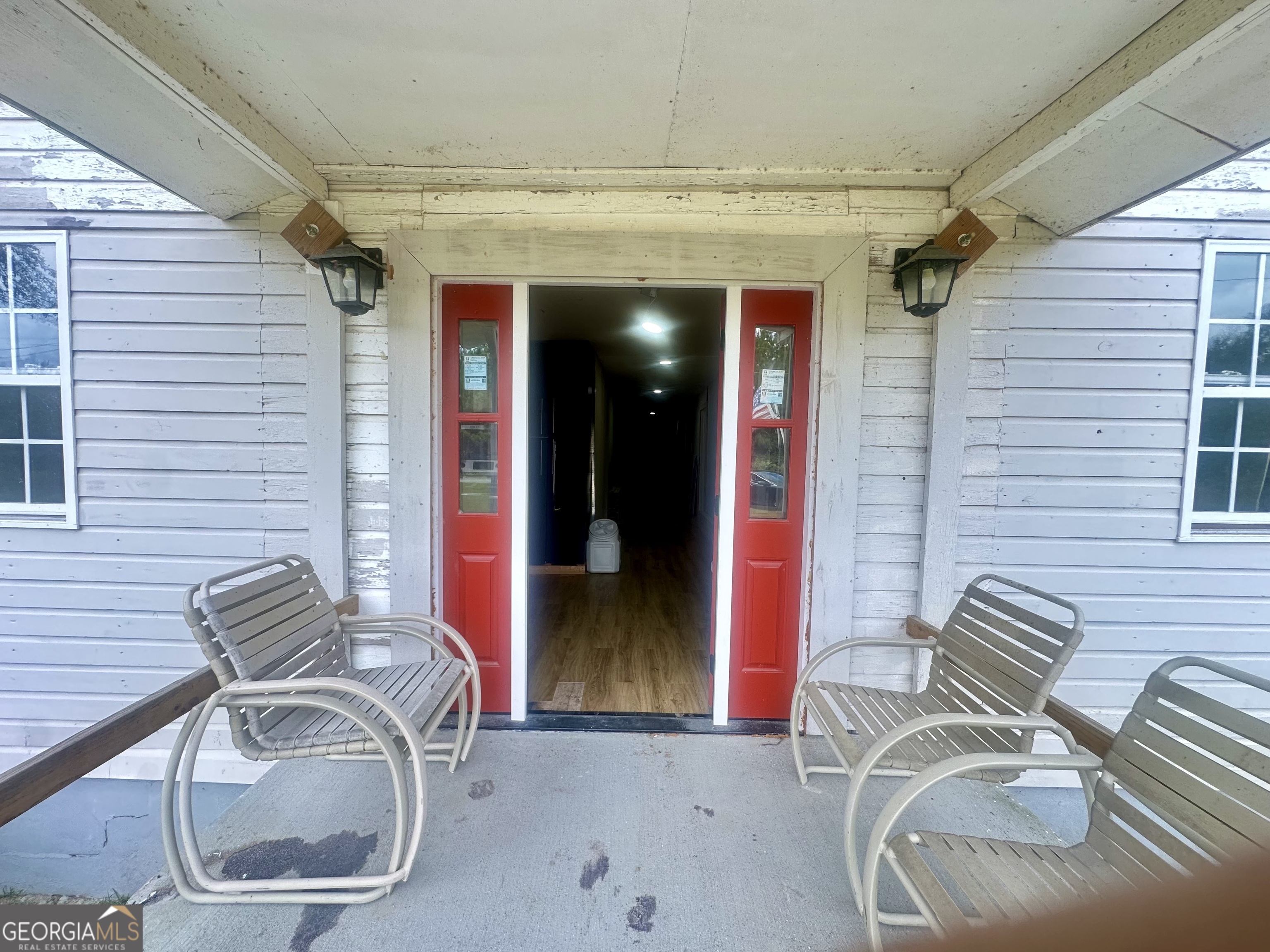 251 Bill Hambrick Road Eastman, GA 31023 - Photo 3 of 32 a backyard of a house with seating space