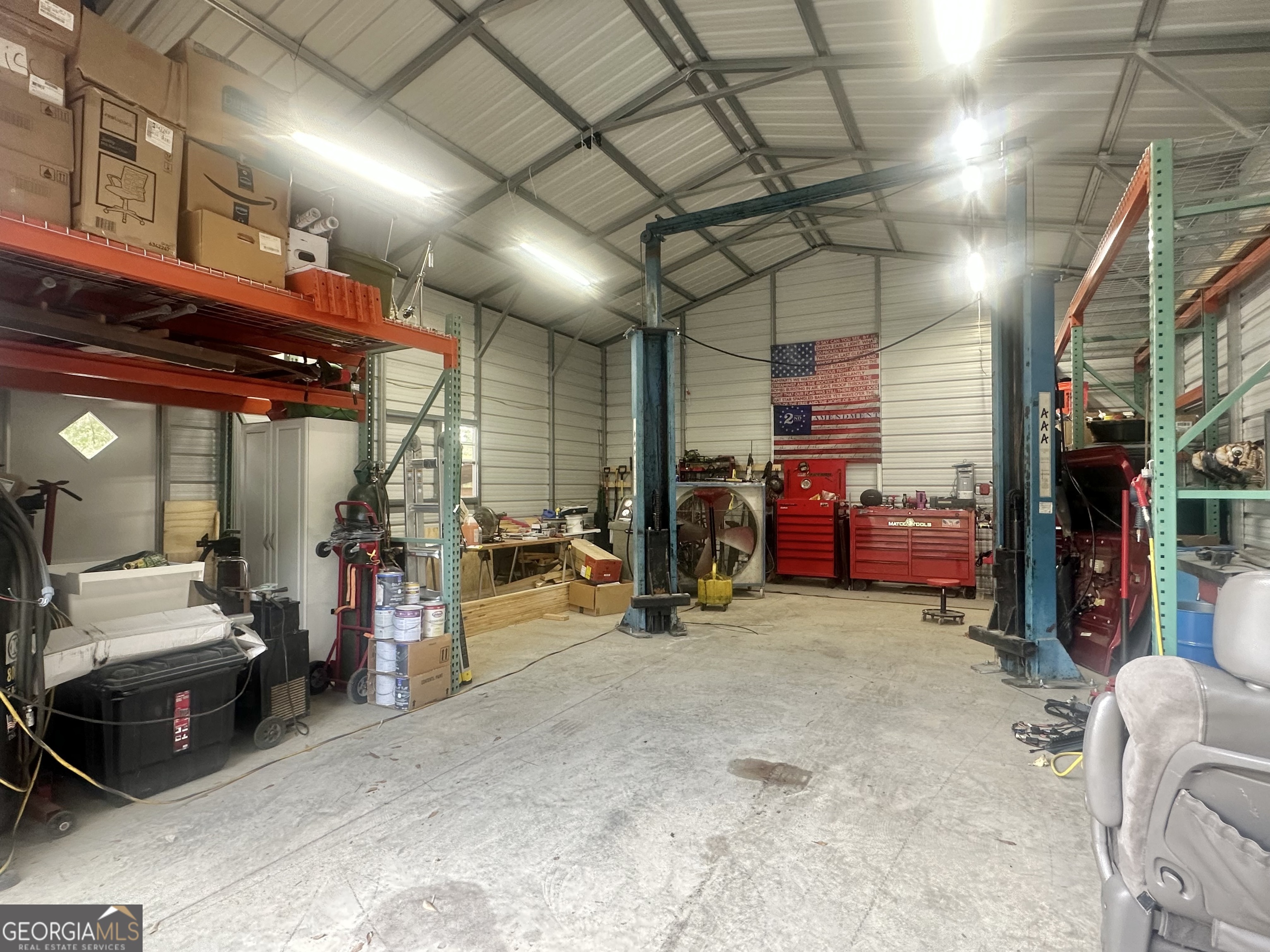 251 Bill Hambrick Road Eastman, GA 31023 - Photo 6 of 32 a view of a garage with furniture and cars