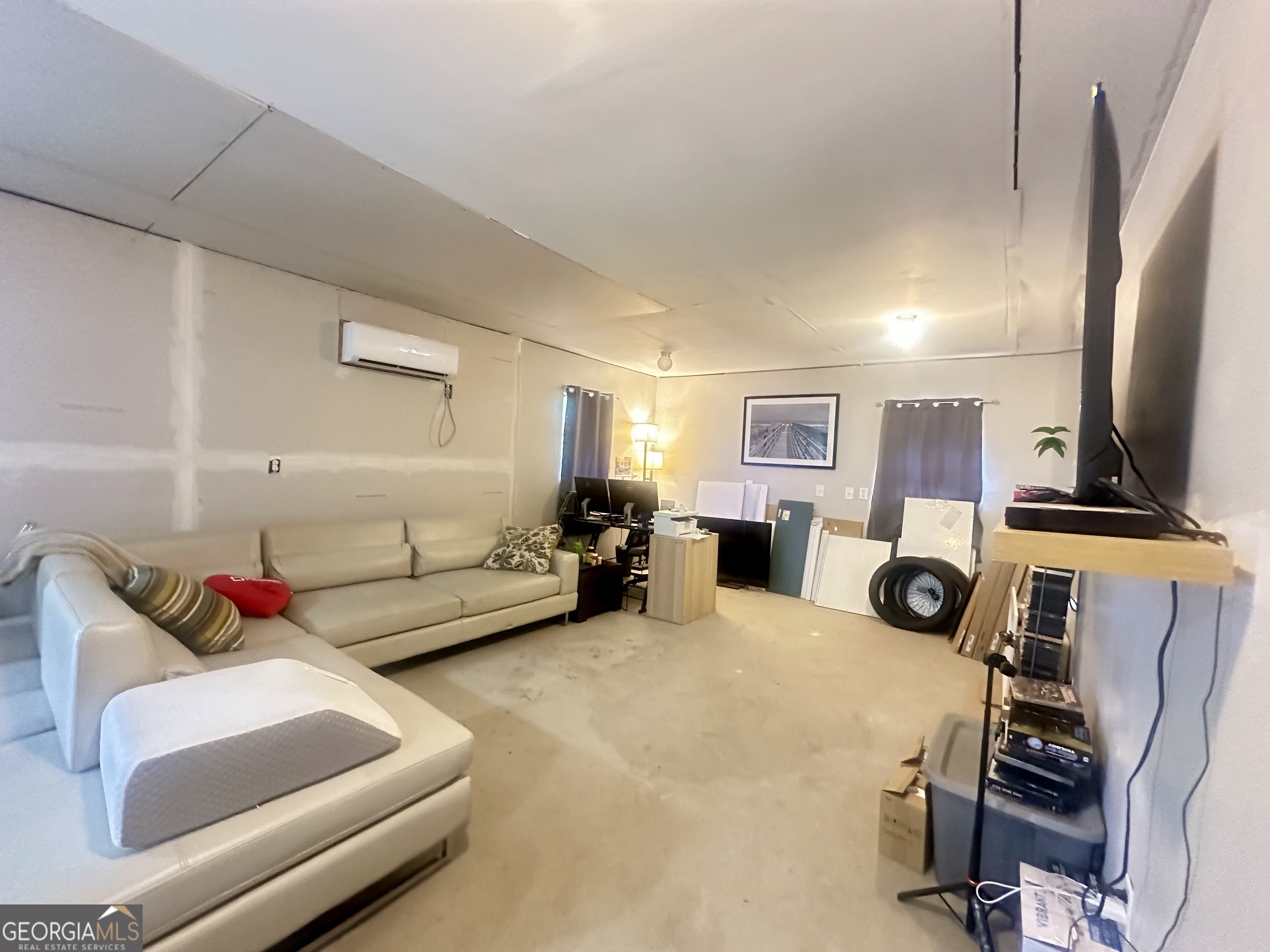 251 Bill Hambrick Road Eastman, GA 31023 - Photo 10 of 32 a living room with furniture and a flat screen tv