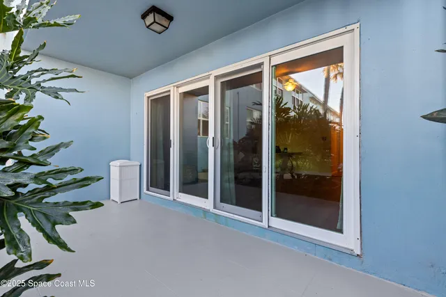 a view of a room with a potted plant
