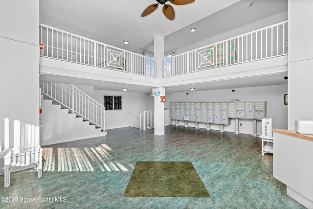 a view of kitchen with furniture and staircase