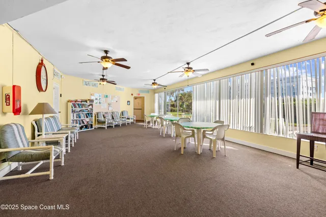 a dining room with furniture and a window