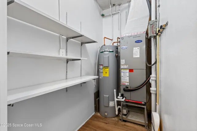 a view of storage and utility room with racks on the wall