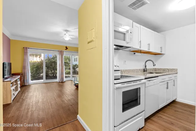 a kitchen with stainless steel appliances granite countertop a stove and a sink