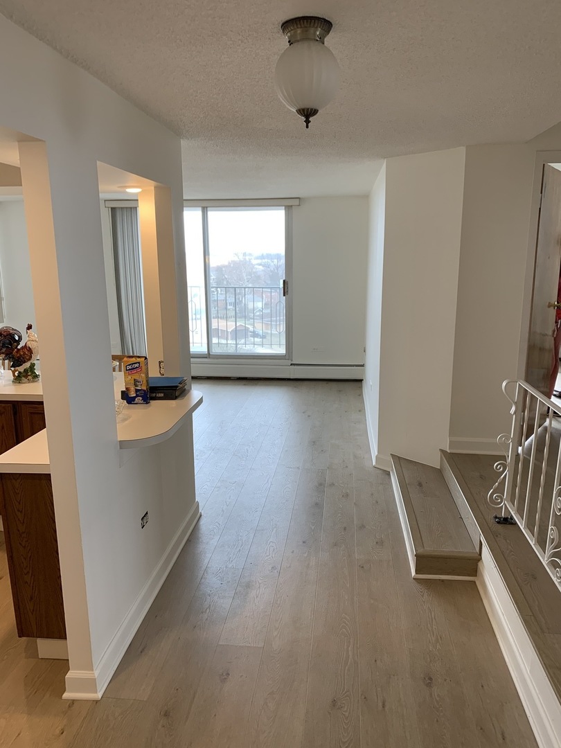 8809 Golf Road, Unit 8A Niles, IL 60714 - Photo 2 of 12 an empty room with windows