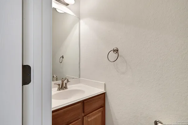 a bathroom with a sink and mirror