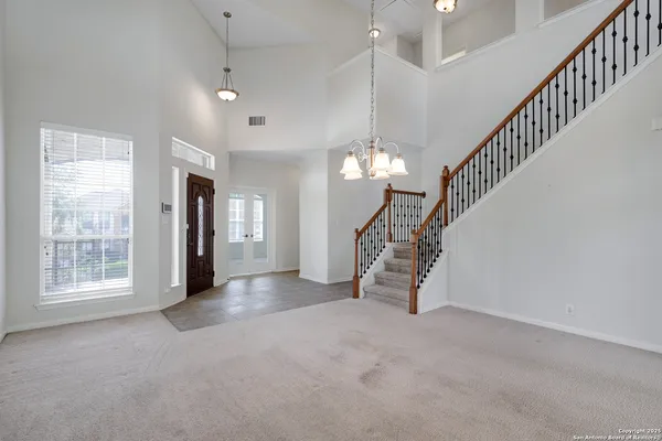 a view of a hallway with staircase
