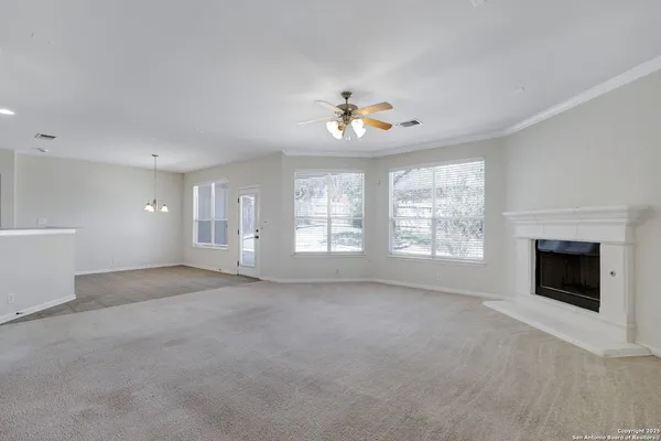 a view of an empty room with a window