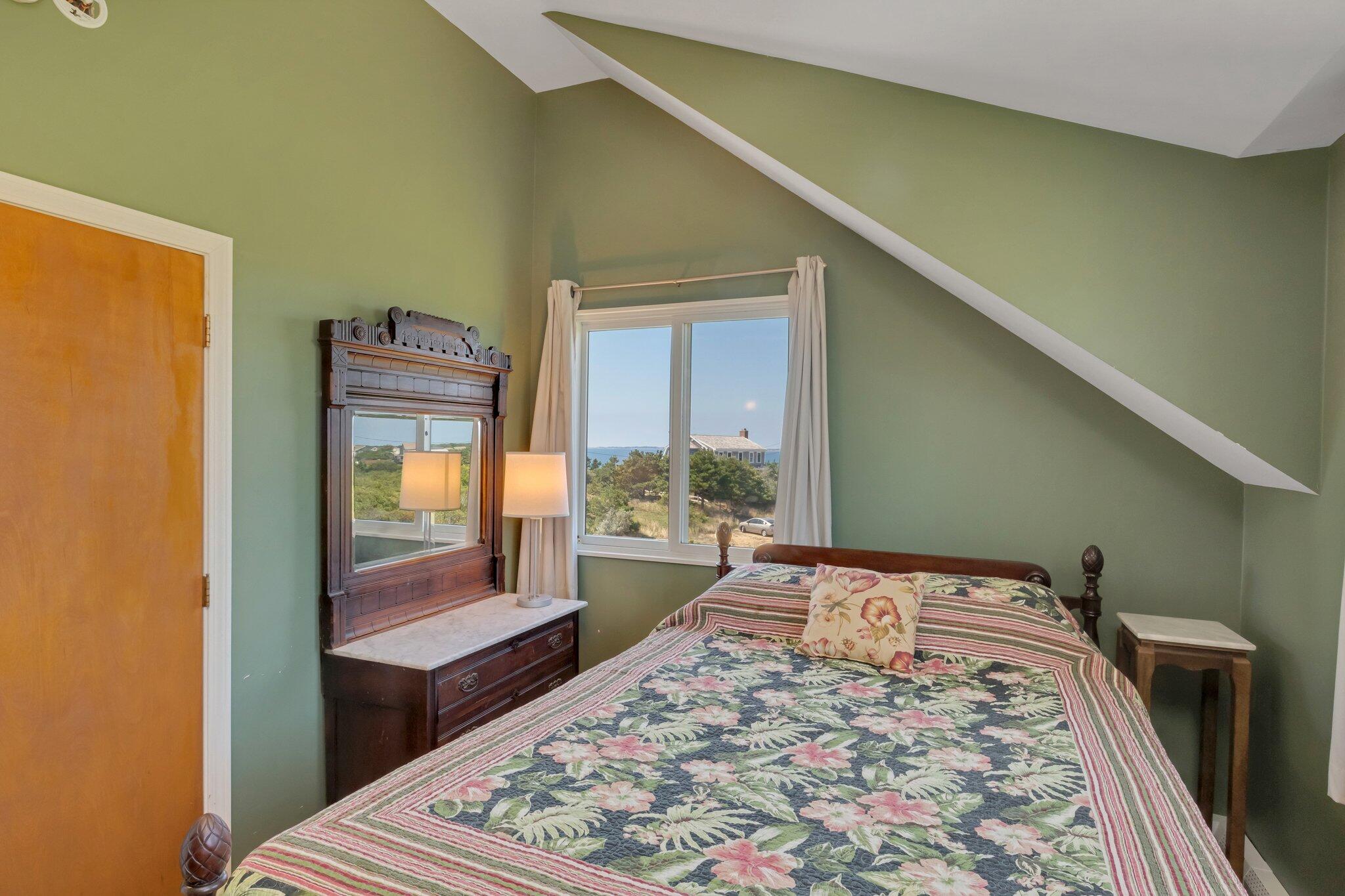 12 Twine Field Road Truro, MA 02666 - Photo 14 of 25 a bedroom with a bed and a large window