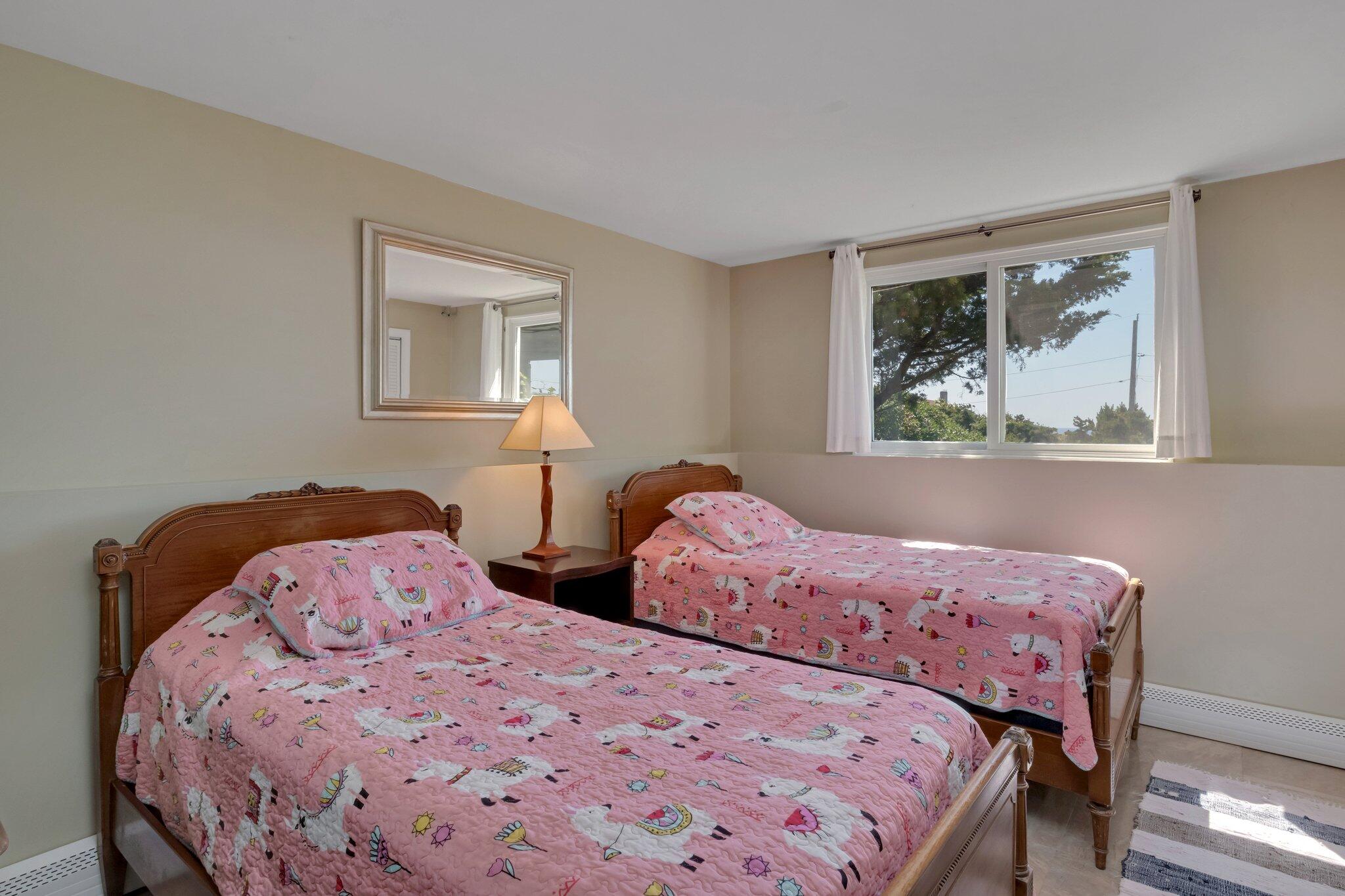 12 Twine Field Road Truro, MA 02666 - Photo 20 of 25 a bedroom with two beds and a painting on the wall