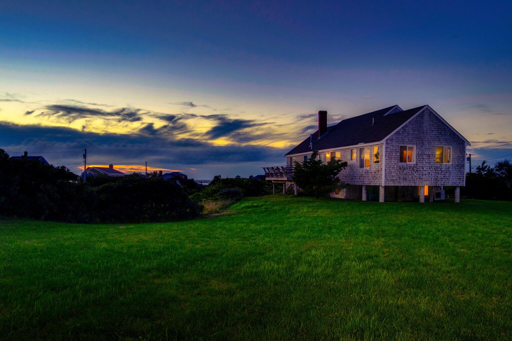 12 Twine Field Road Truro, MA 02666 - Photo 22 of 25 a view of a big house with a big yard