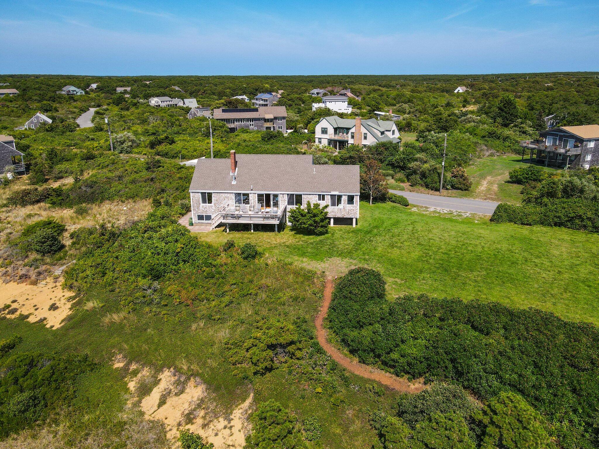 12 Twine Field Road Truro, MA 02666 - Photo 3 of 25 an aerial view of residential houses with outdoor space and trees all around