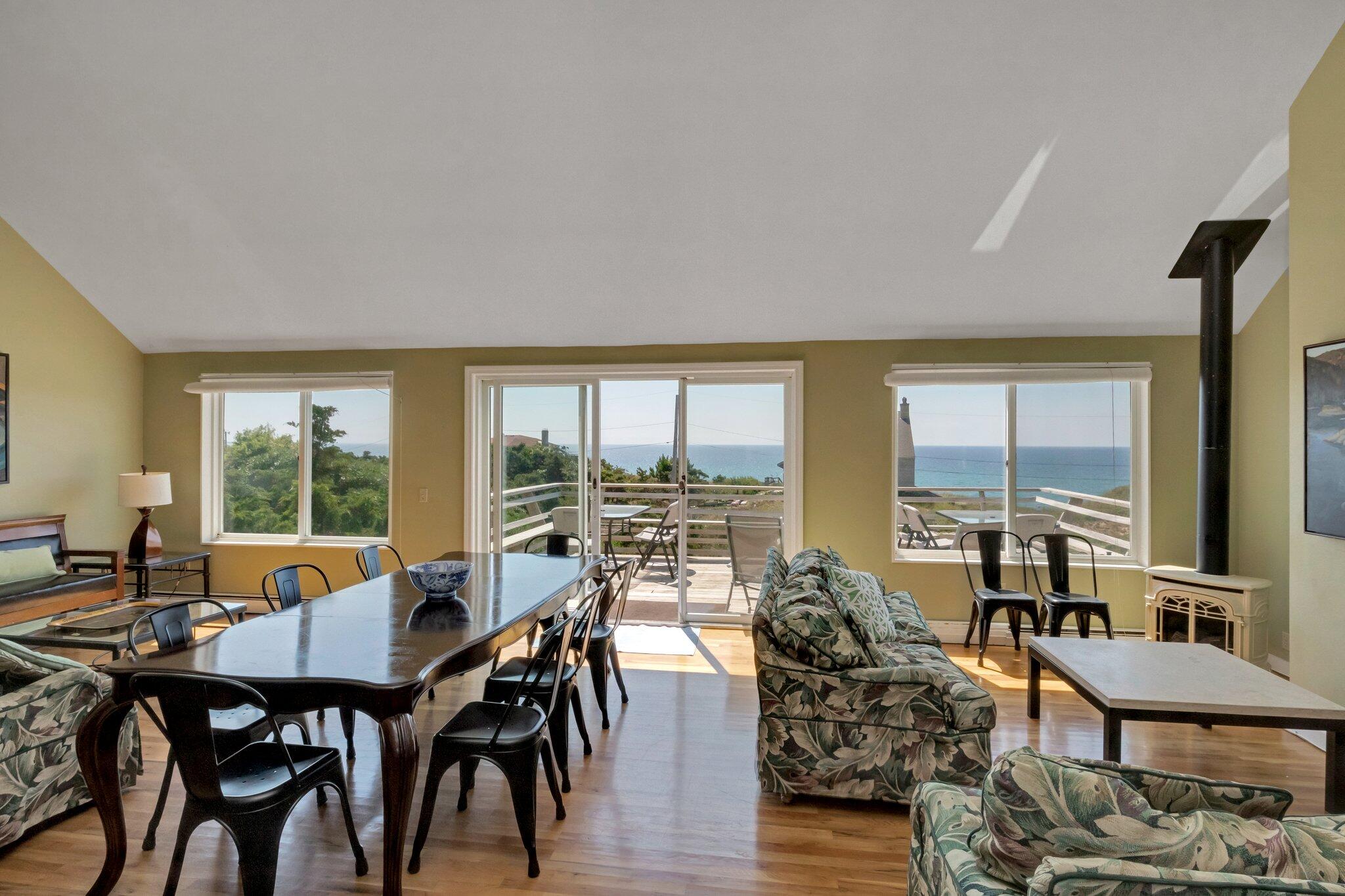 12 Twine Field Road Truro, MA 02666 - Photo 6 of 25 a living room with furniture and large windows