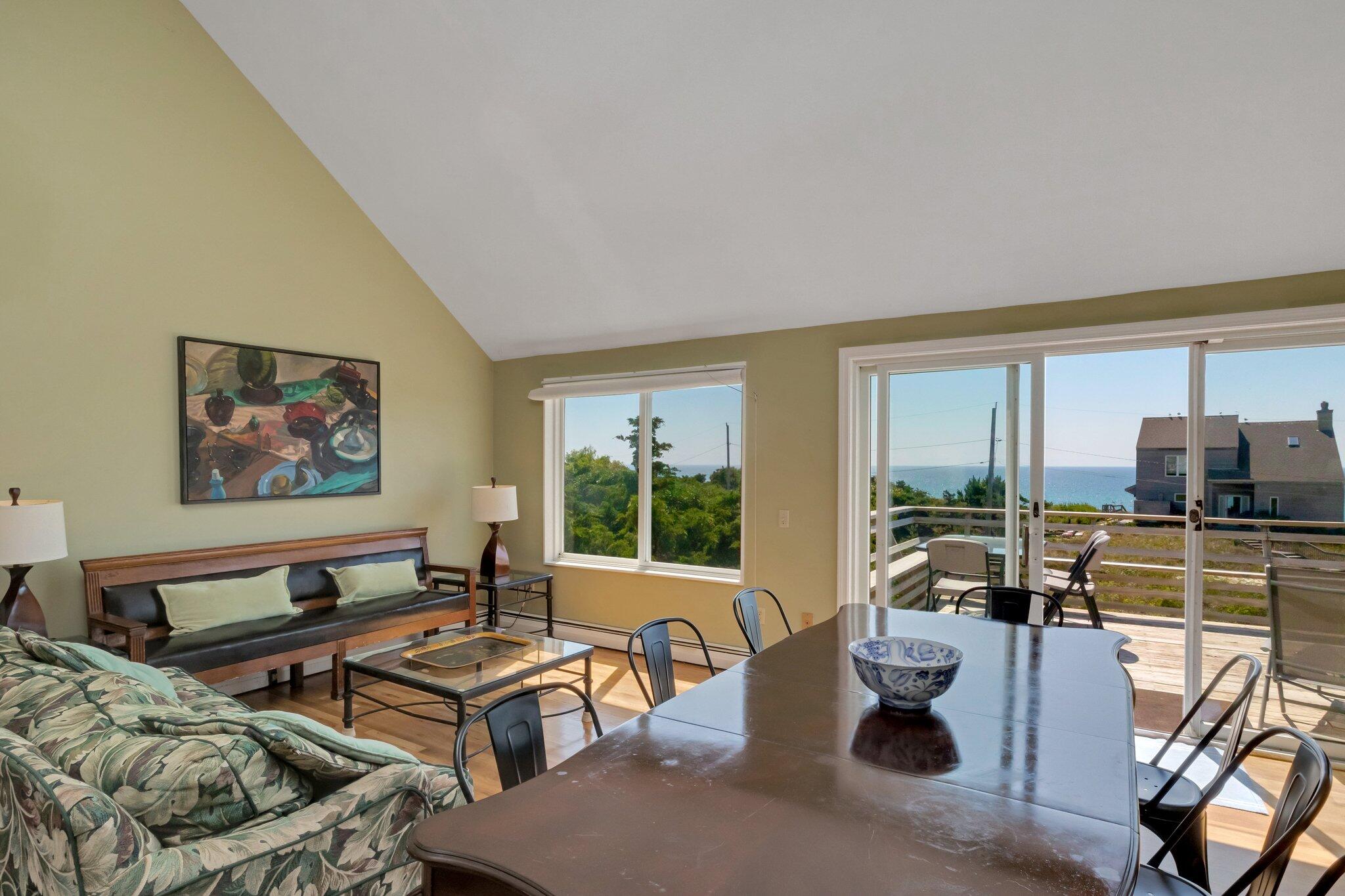 12 Twine Field Road Truro, MA 02666 - Photo 8 of 25 a living room with furniture kitchen view and a large window