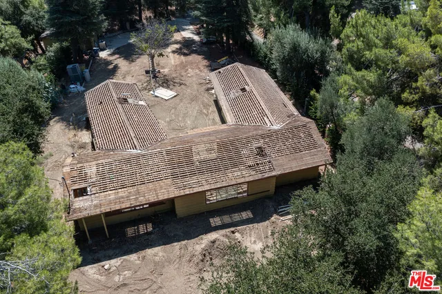 an aerial view of a house with outdoor space