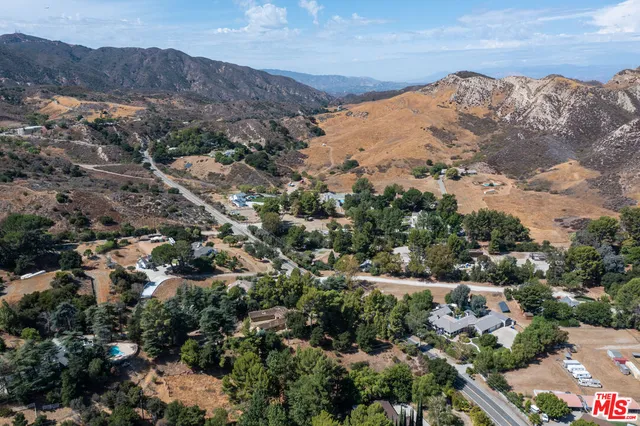 an aerial view of mountain with beach