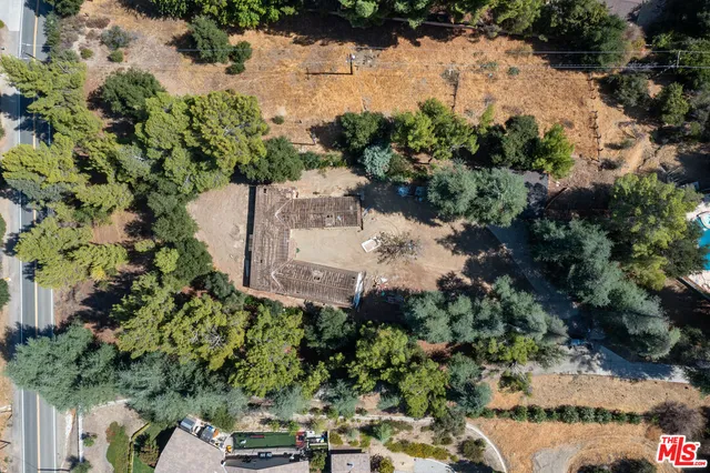 an aerial view of a garden with houses