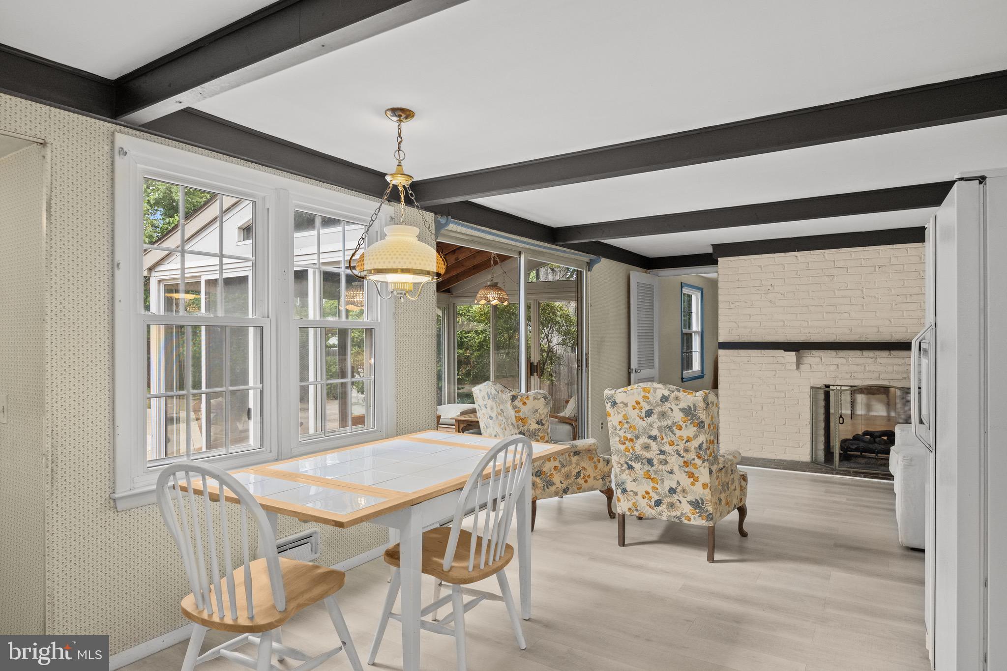 195 Pearl Croft Road Cherry Hill, NJ 08034 - Photo 11 of 38 a dining room with furniture large windows and a chandelier