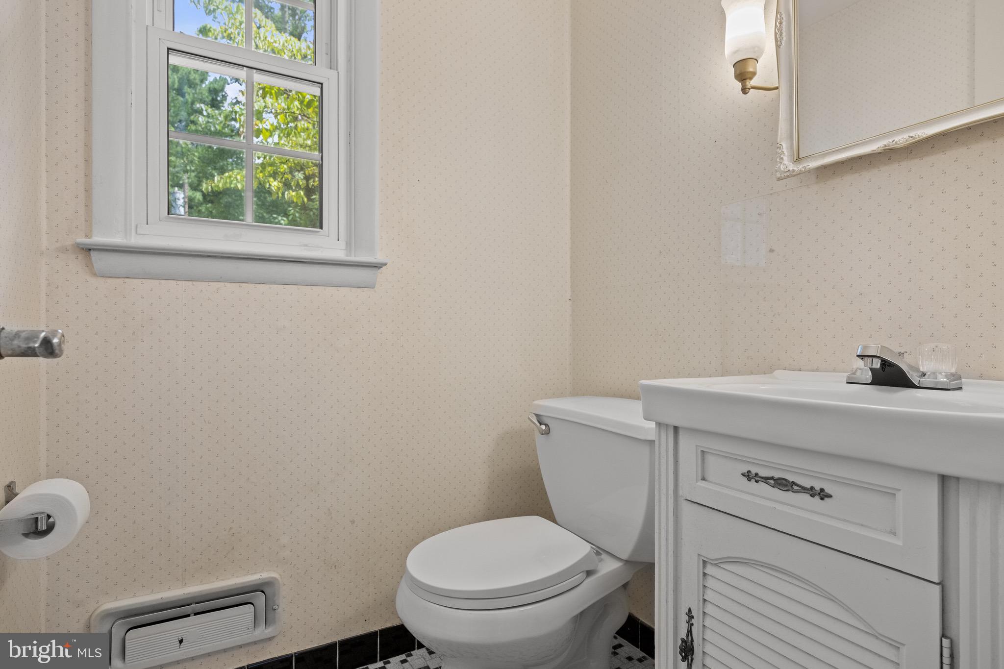 195 Pearl Croft Road Cherry Hill, NJ 08034 - Photo 16 of 38 a bathroom with a toilet a sink and a window