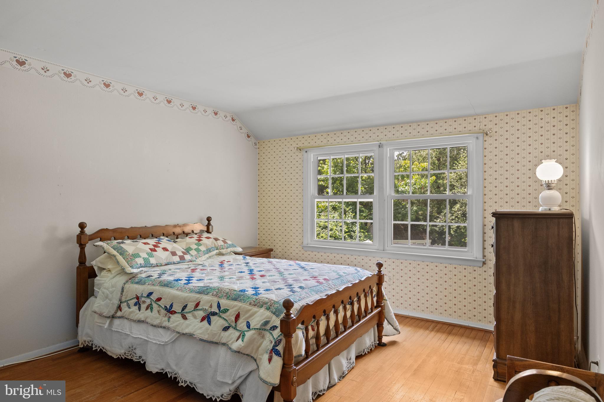 195 Pearl Croft Road Cherry Hill, NJ 08034 - Photo 17 of 38 a bedroom with a bed and wooden floor