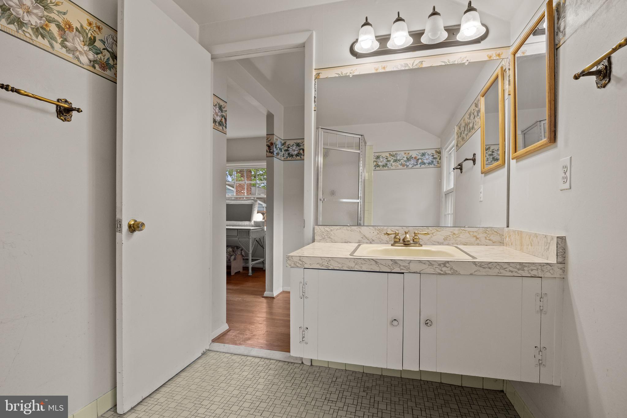 195 Pearl Croft Road Cherry Hill, NJ 08034 - Photo 23 of 38 a bathroom with a granite countertop sink and a mirror