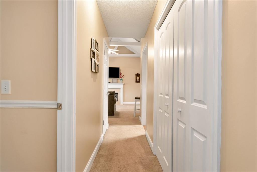 1044 Lothridge Road Cleveland, GA 30528 - Photo 22 of 40 a view of a hallway with wooden floor and a bathroom