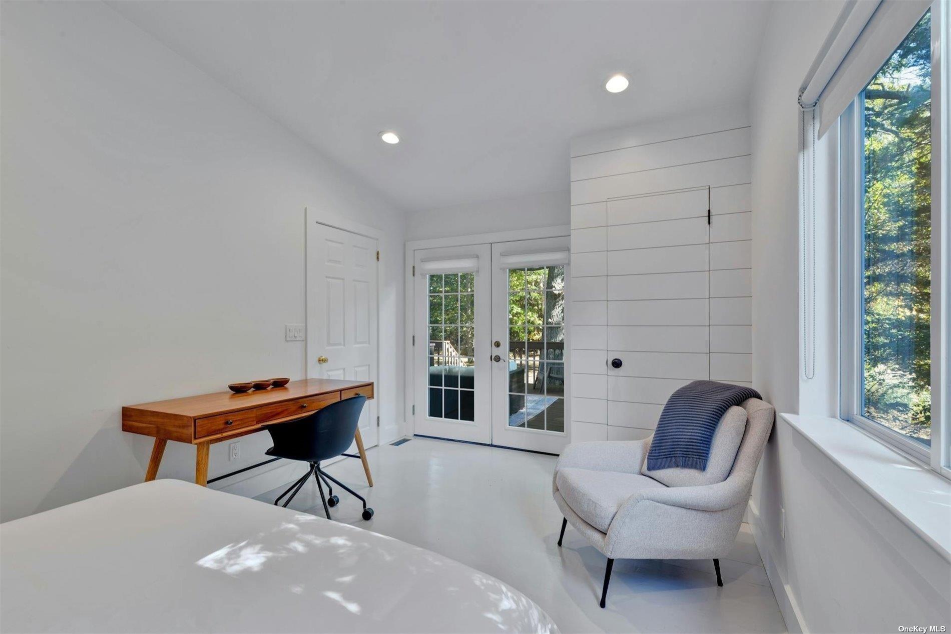 3670 Rocky Point Road East Marion, NY 11939 - Photo 15 of 26 a view of a workspace with furniture and a window