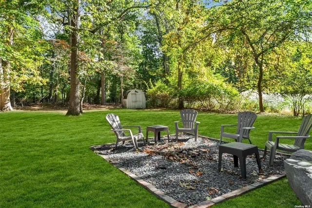a view of a garden with sitting area
