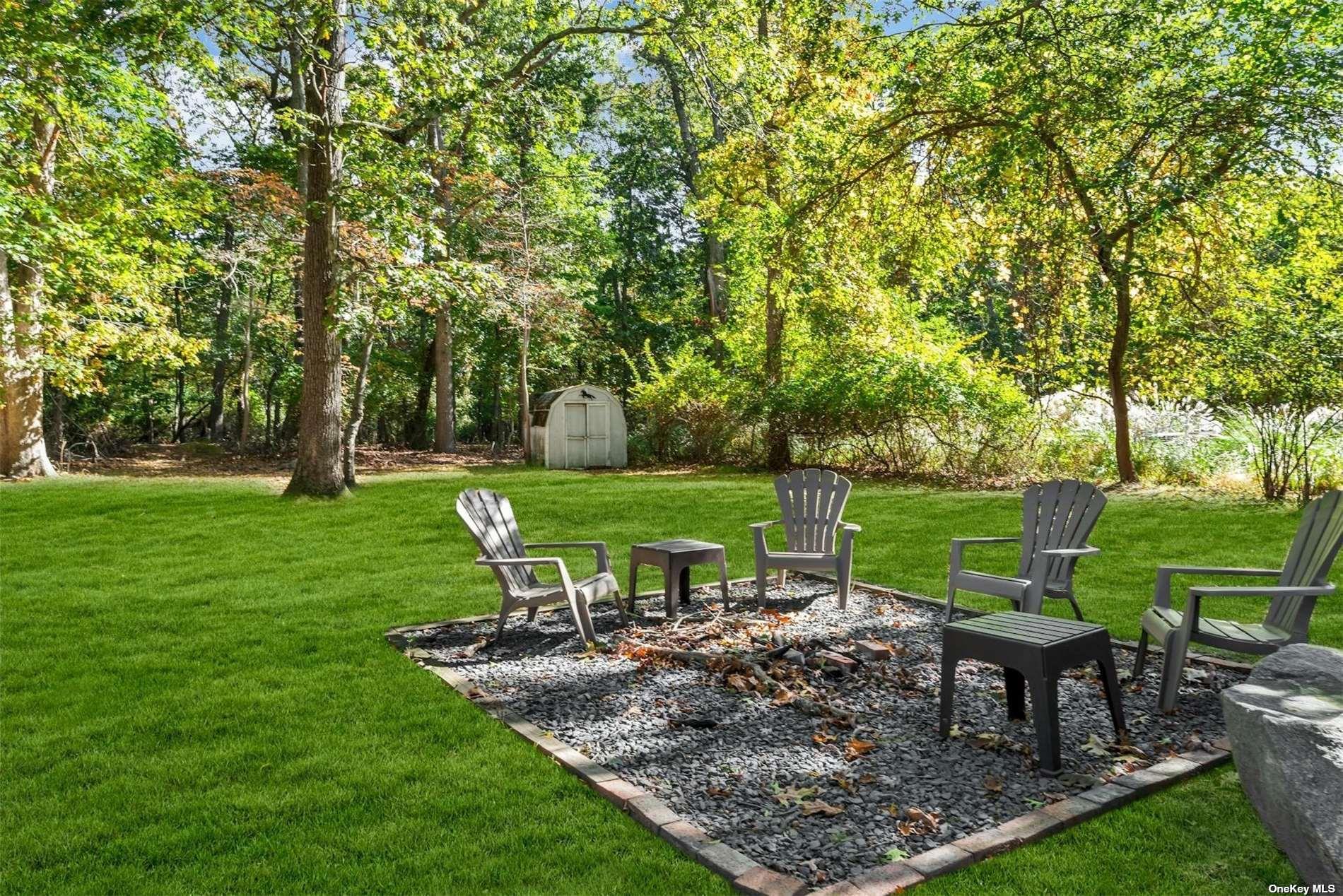 3670 Rocky Point Road East Marion, NY 11939 - Photo 19 of 26 a view of a garden with sitting area