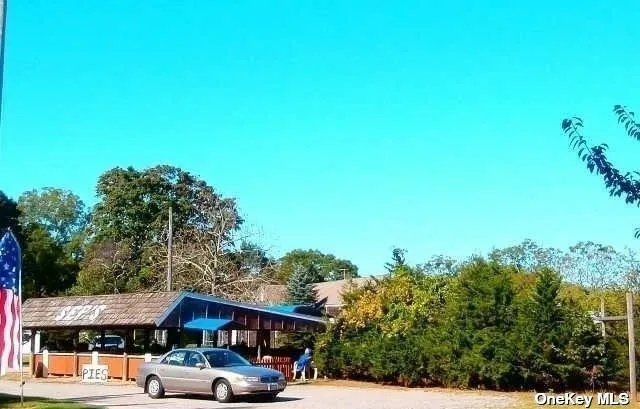 a view of a car parked in front of a building