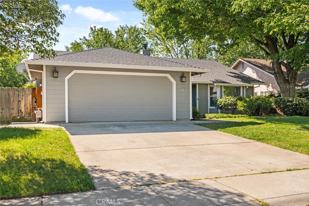 259 Picholine Way Chico, CA 95928 - Photo 12 of 38 a front view of a house with a yard and garage