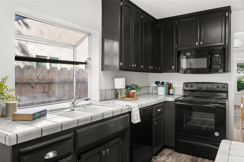 259 Picholine Way Chico, CA 95928 - Photo 22 of 38 a kitchen with a sink stove and microwave