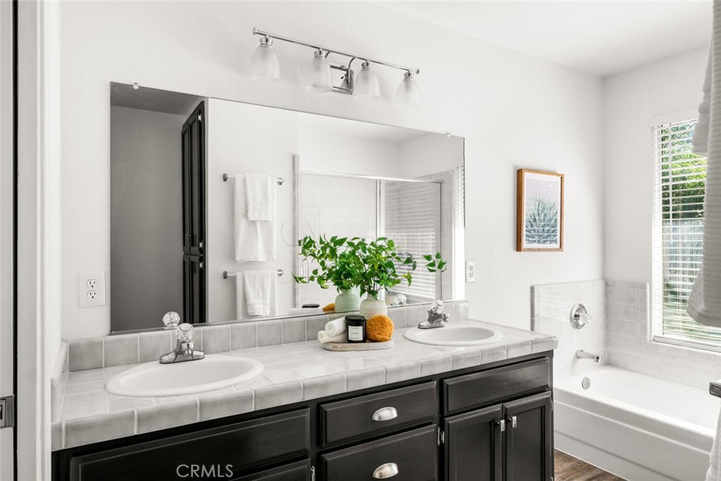 259 Picholine Way Chico, CA 95928 - Photo 25 of 38 a bathroom with a sink and a mirror