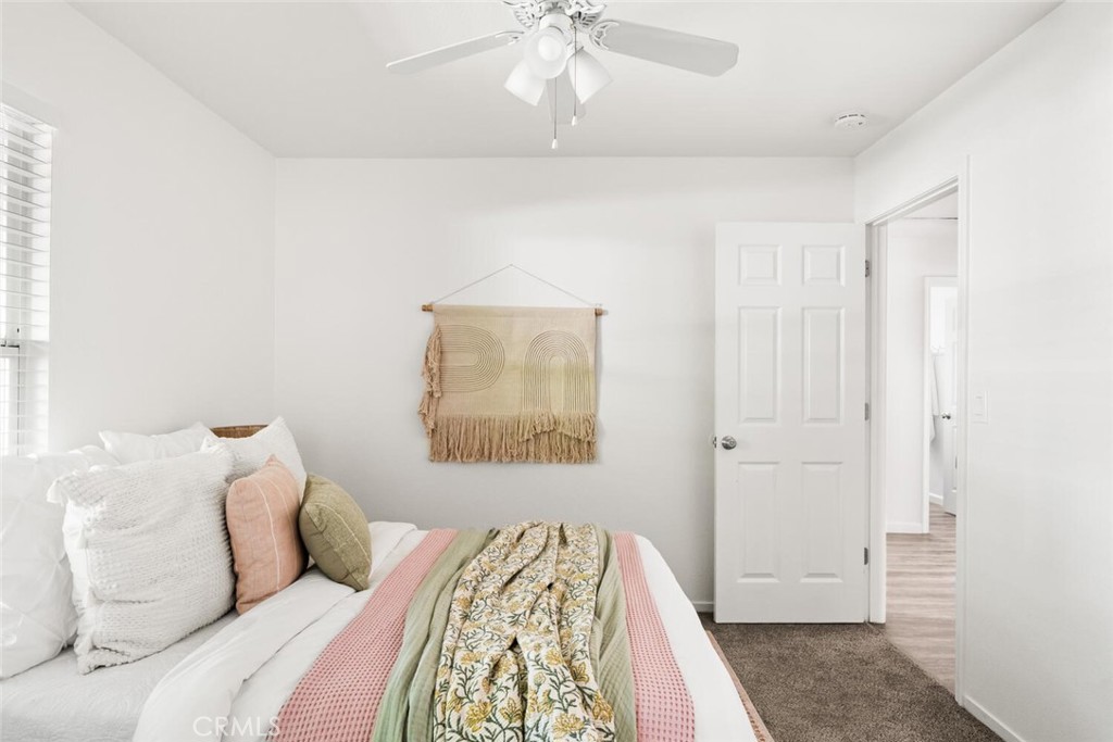 259 Picholine Way Chico, CA 95928 - Photo 31 of 38 a bedroom with a bed and a chandelier