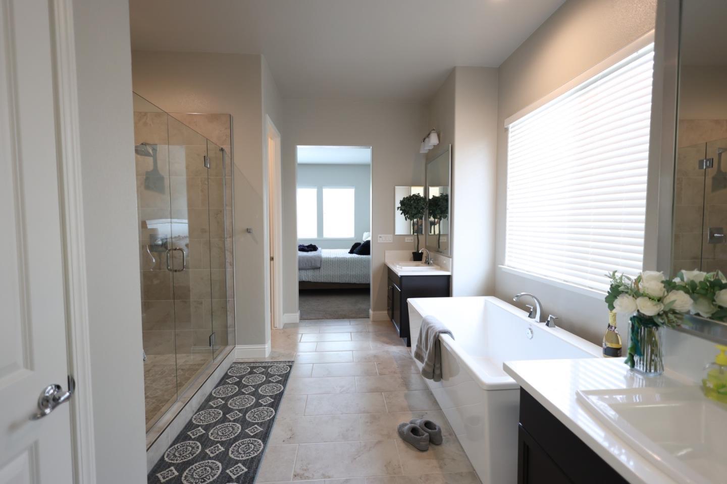 478 Logan Way Marina, CA 93933 - Photo 15 of 42 a bathroom with a tub sink and mirror