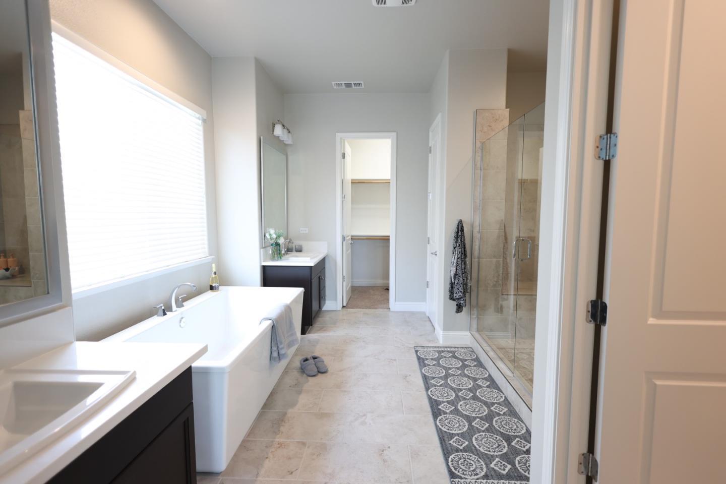 478 Logan Way Marina, CA 93933 - Photo 25 of 42 a bathroom with a tub sink and mirror