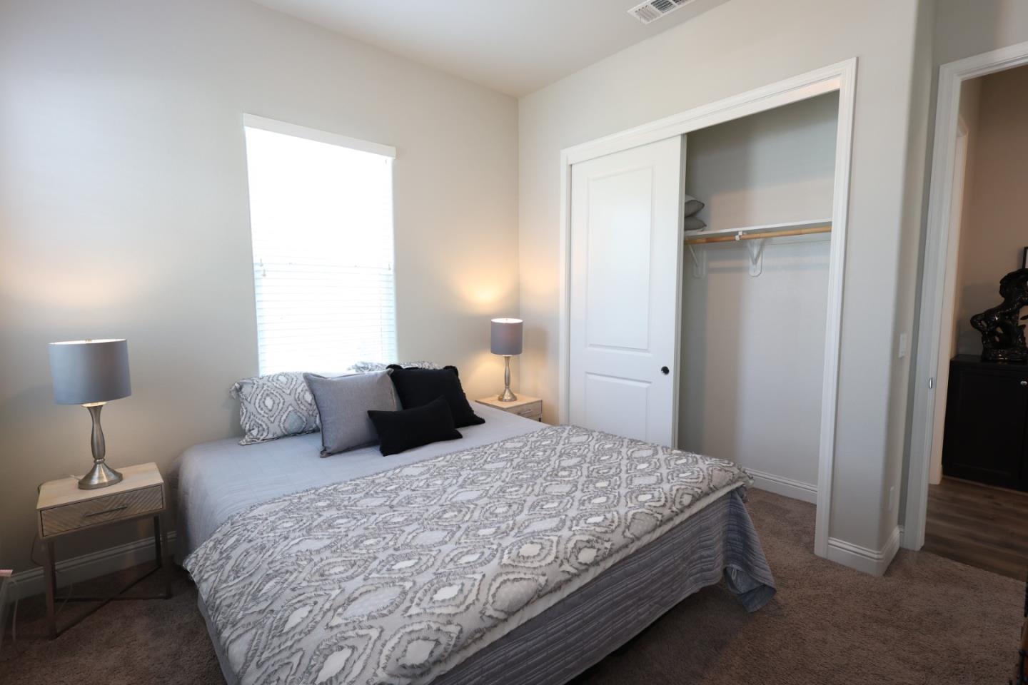 478 Logan Way Marina, CA 93933 - Photo 36 of 42 a bedroom with a bed and a night stand